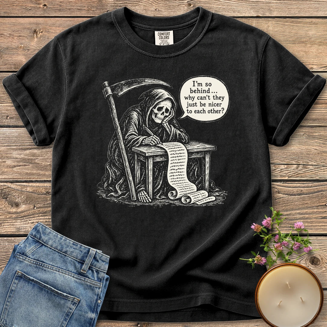 Just Be Nicer t-shirt, a grim reaper at a desk with a long list saying I'm so behind, why can't they just be nicer to each other?, on a Black Comfort Colors tee