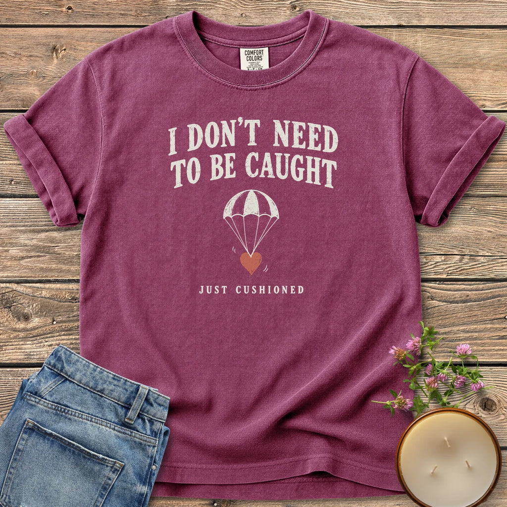 Just Cushioned t-shirt, I Don't Need To Be Caught with a heart on a parachute and Just Cushioned, on a Berry Comfort Colors tee