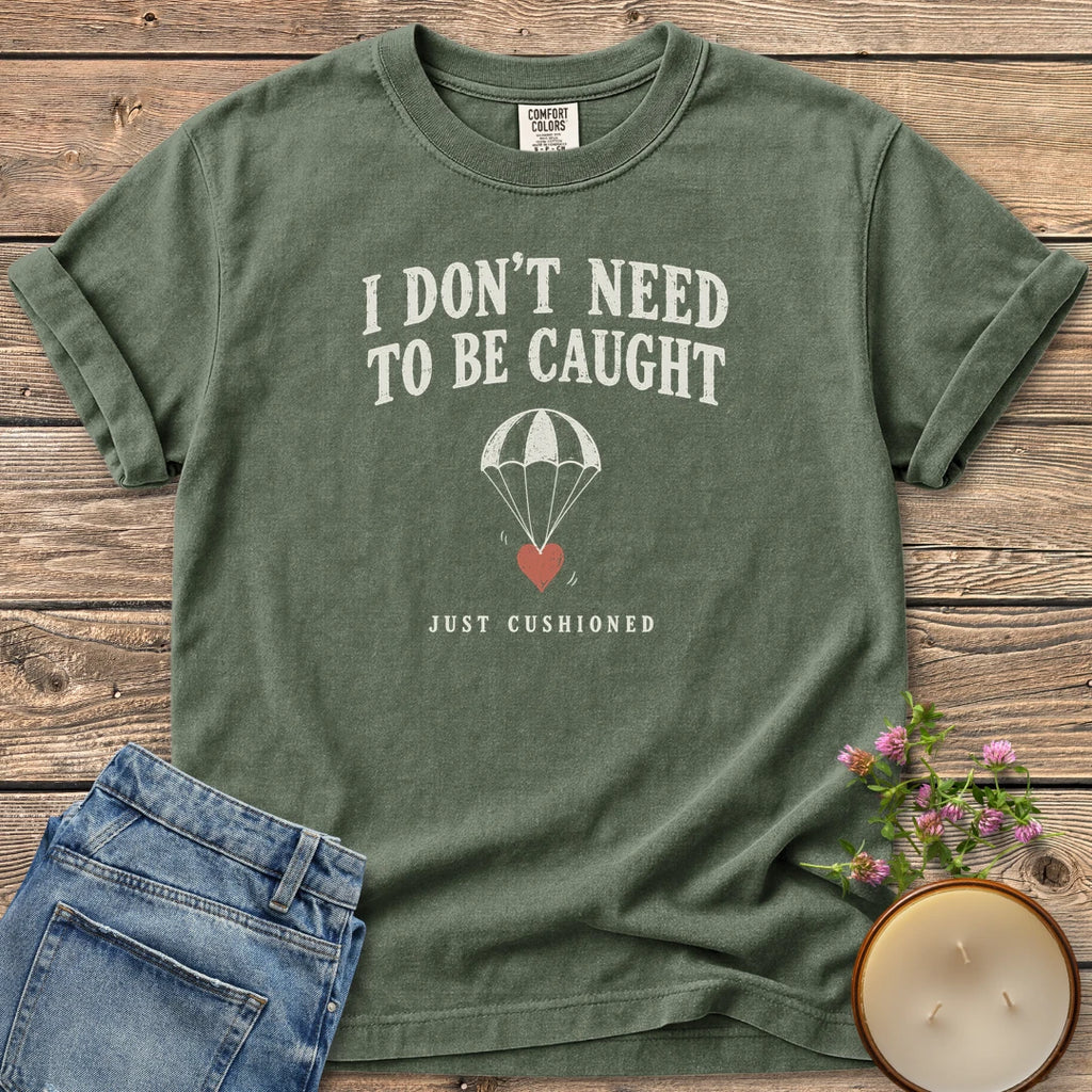 Just Cushioned t-shirt, I Don't Need To Be Caught with a heart on a parachute and Just Cushioned, on a Moss Comfort Colors tee