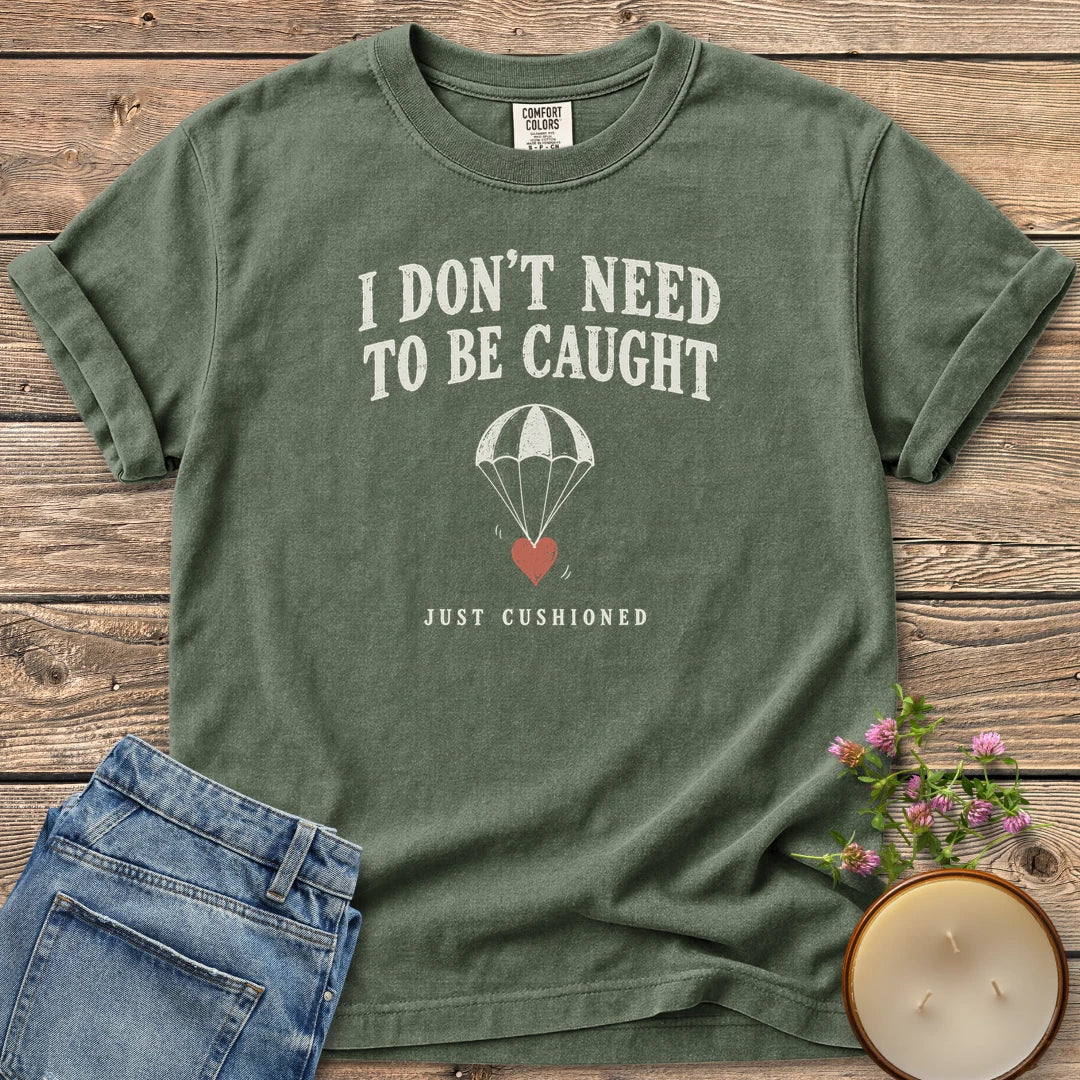 Just Cushioned t-shirt, I Don't Need To Be Caught with a heart on a parachute and Just Cushioned, on a Moss Comfort Colors tee