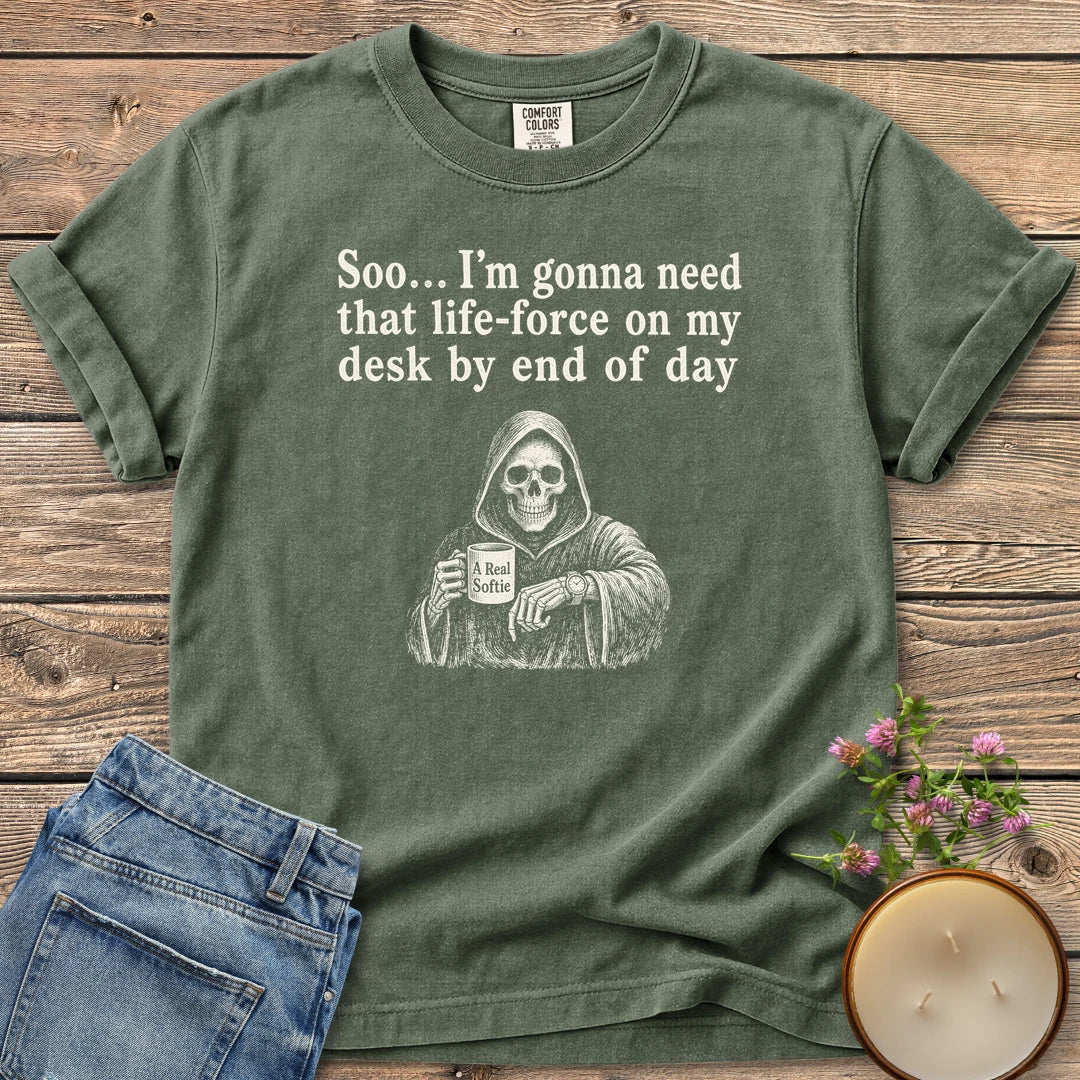 Life-Force On My Desk t-shirt, a grim reaper holding an A Real Softie mug and checking his watch under Soo... I'm gonna need that life-force on my desk by end of day, on a Moss Comfort Colors tee