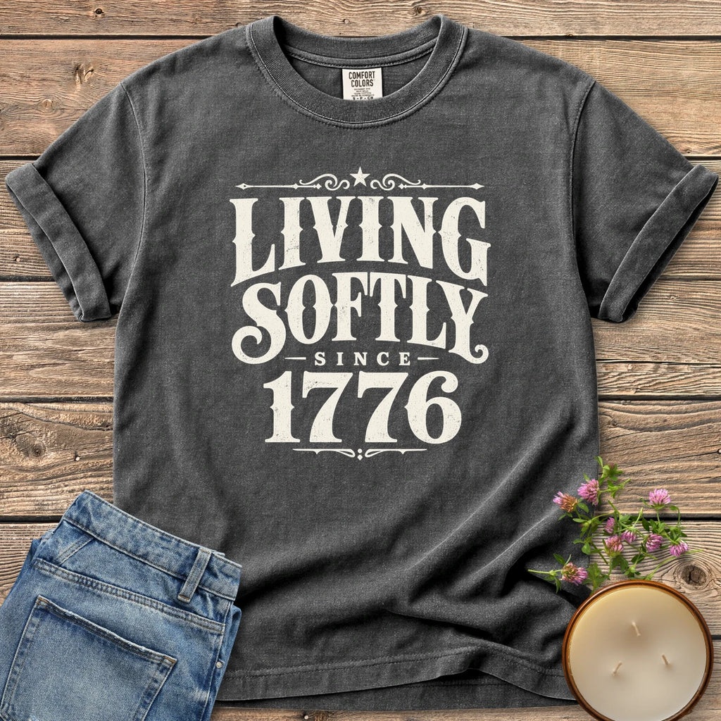 Living Softly Since 1776 t-shirt, Living Softly Since 1776 in ornate vintage type, on a Pepper Comfort Colors tee