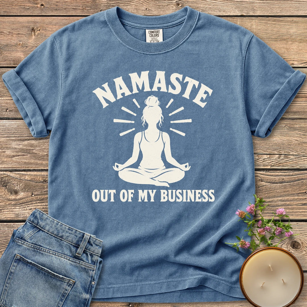 Namaste Out Of My Business t-shirt, a meditating woman under Namaste above Out Of My Business, on a Blue Jean Comfort Colors tee