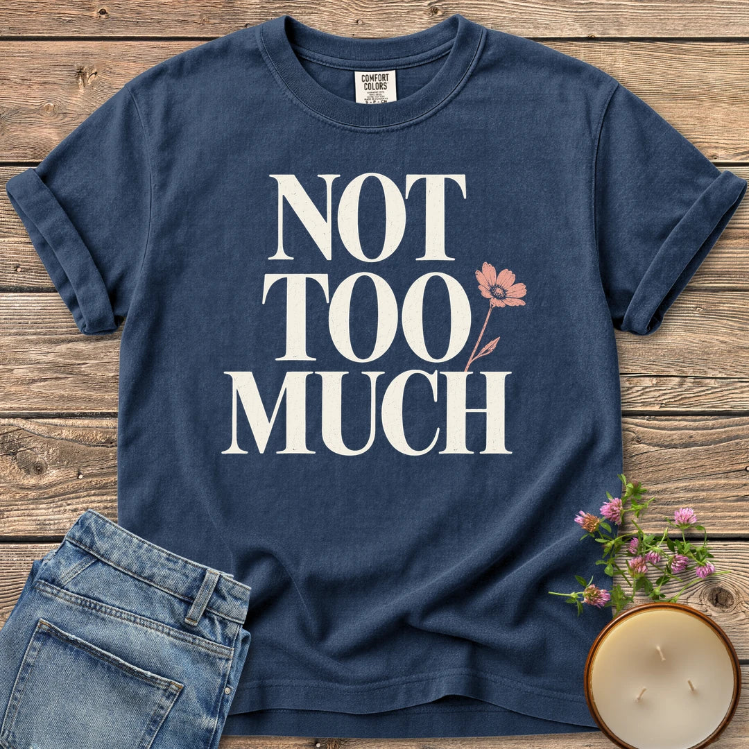 Not Too Much t-shirt, Not Too Much in tall serif letters with a pink flower, on a Navy Comfort Colors tee
