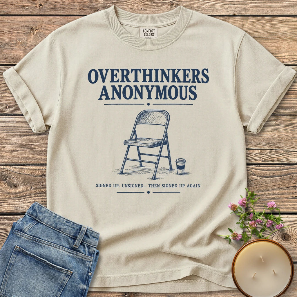 Overthinkers Anonymous t-shirt, Overthinkers Anonymous with a folding chair and Signed Up. Unsigned... Then Signed Up Again, on an Ivory Comfort Colors tee