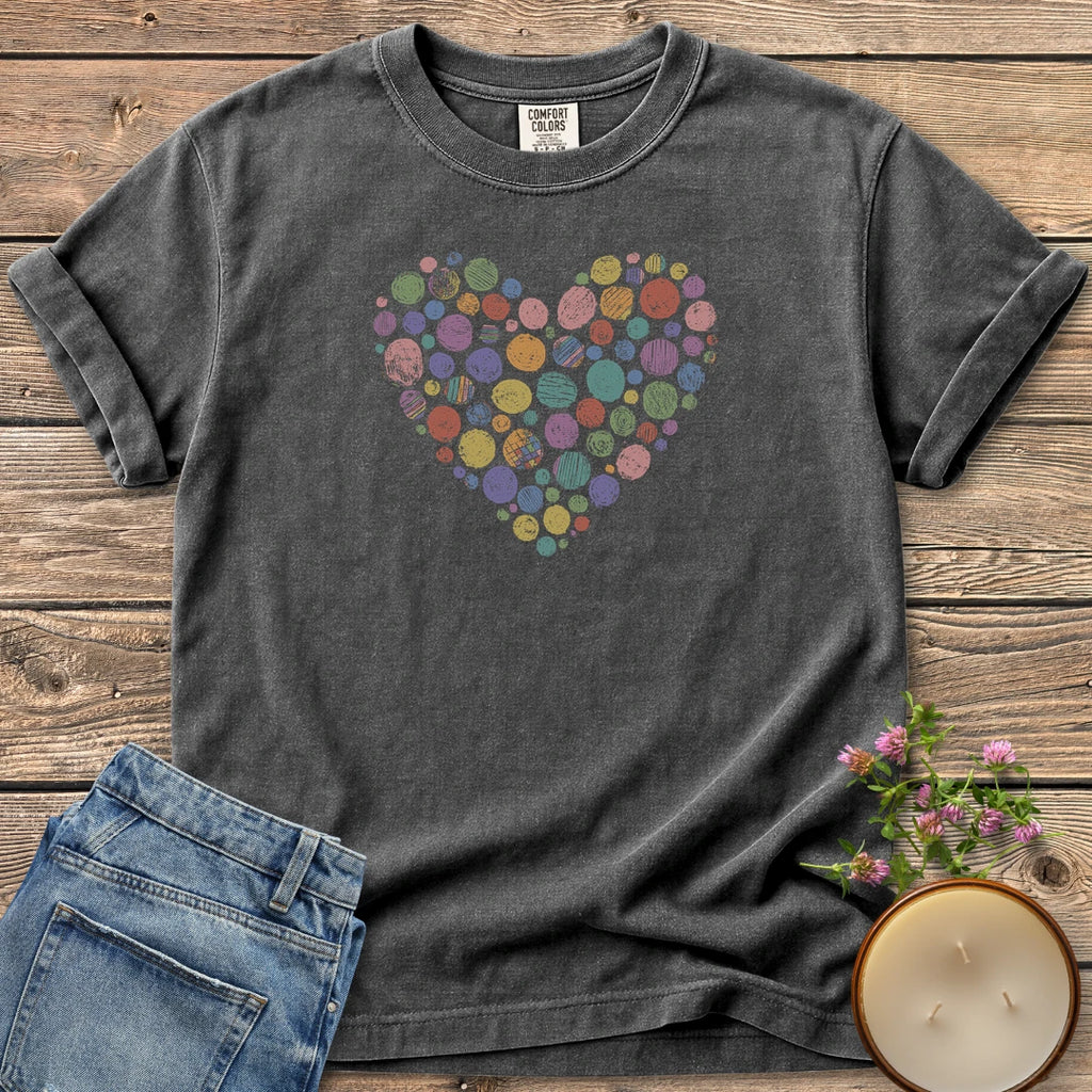 Rainbow Stipple Heart t-shirt, a heart made of colorful textured circles, on a Pepper Comfort Colors tee