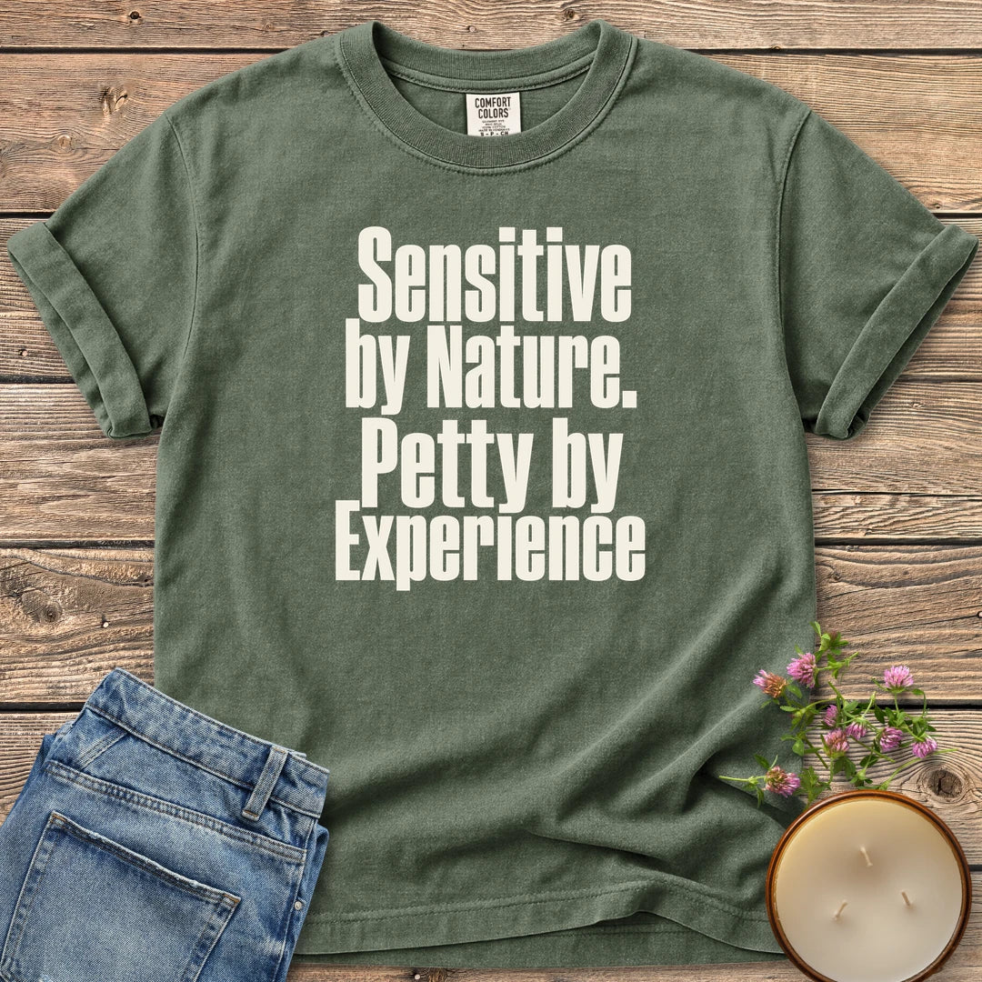 Sensitive by Nature t-shirt, Sensitive by Nature. Petty by Experience. in bold condensed type, on a Moss Comfort Colors tee