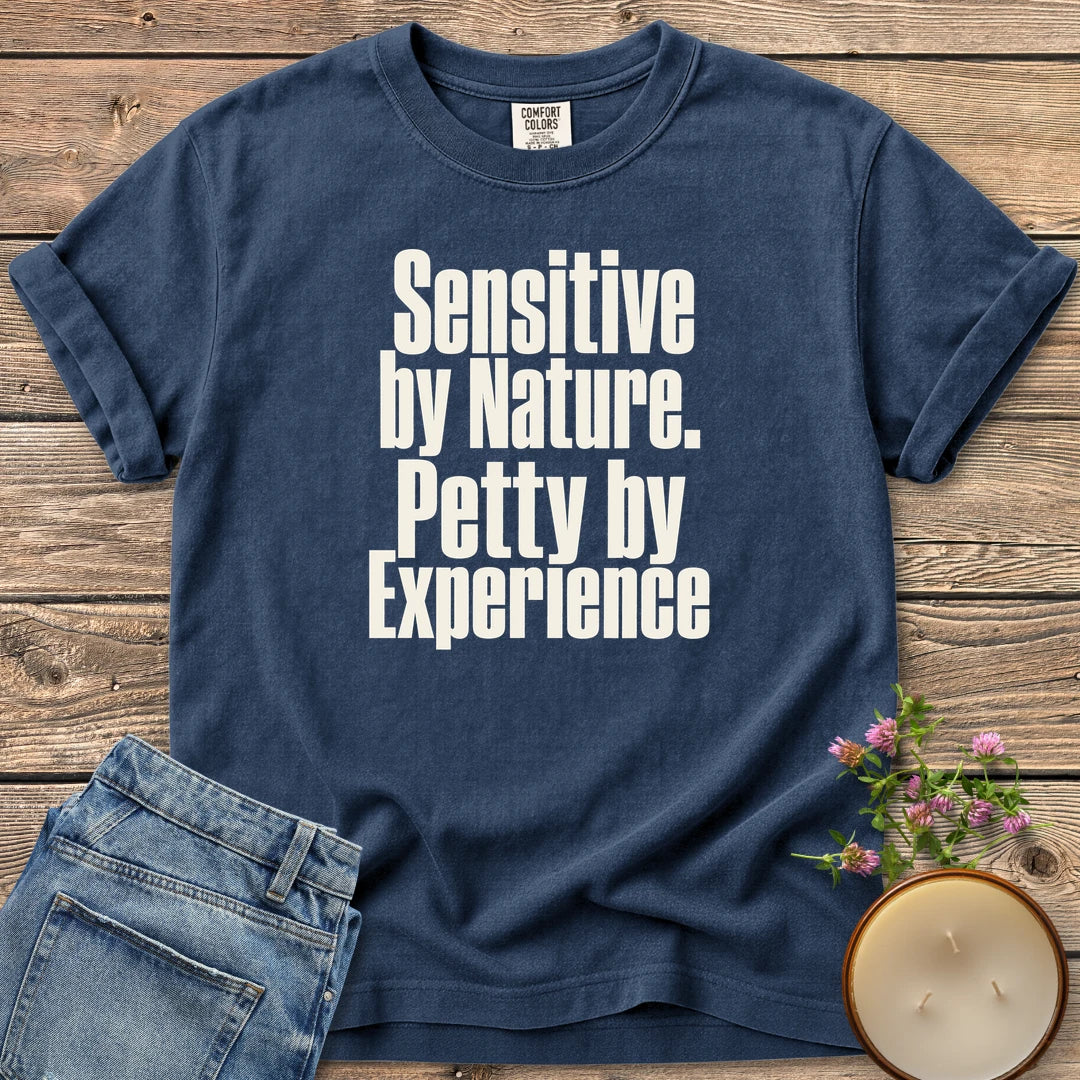 Sensitive by Nature t-shirt, Sensitive by Nature. Petty by Experience. in bold condensed type, on a Navy Comfort Colors tee
