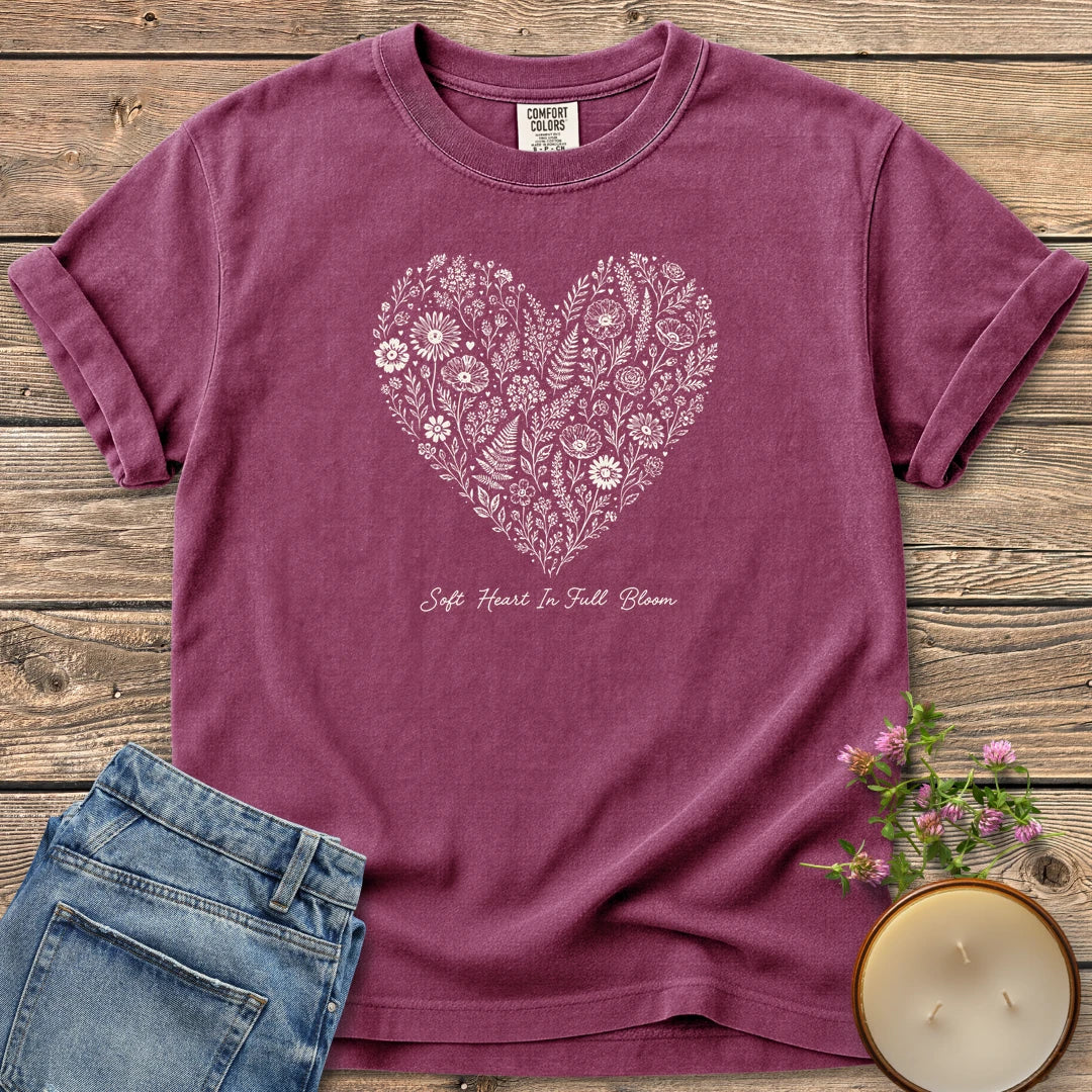 Soft Heart In Full Bloom t-shirt, a heart filled with wildflowers and ferns above Soft Heart In Full Bloom, on a Berry Comfort Colors tee