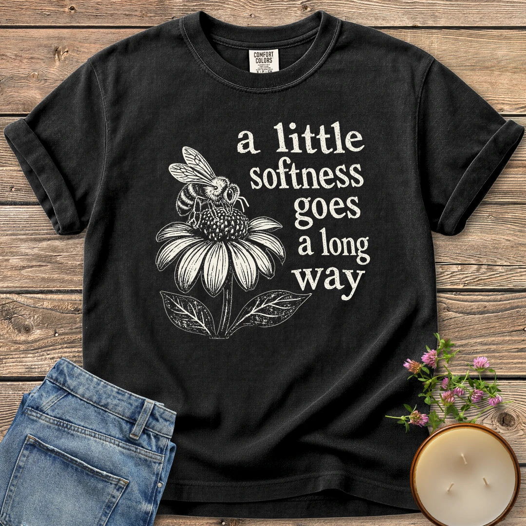 Softness Goes a Long Way t-shirt, a bee on a coneflower with a little softness goes a long way, on a Black Comfort Colors tee