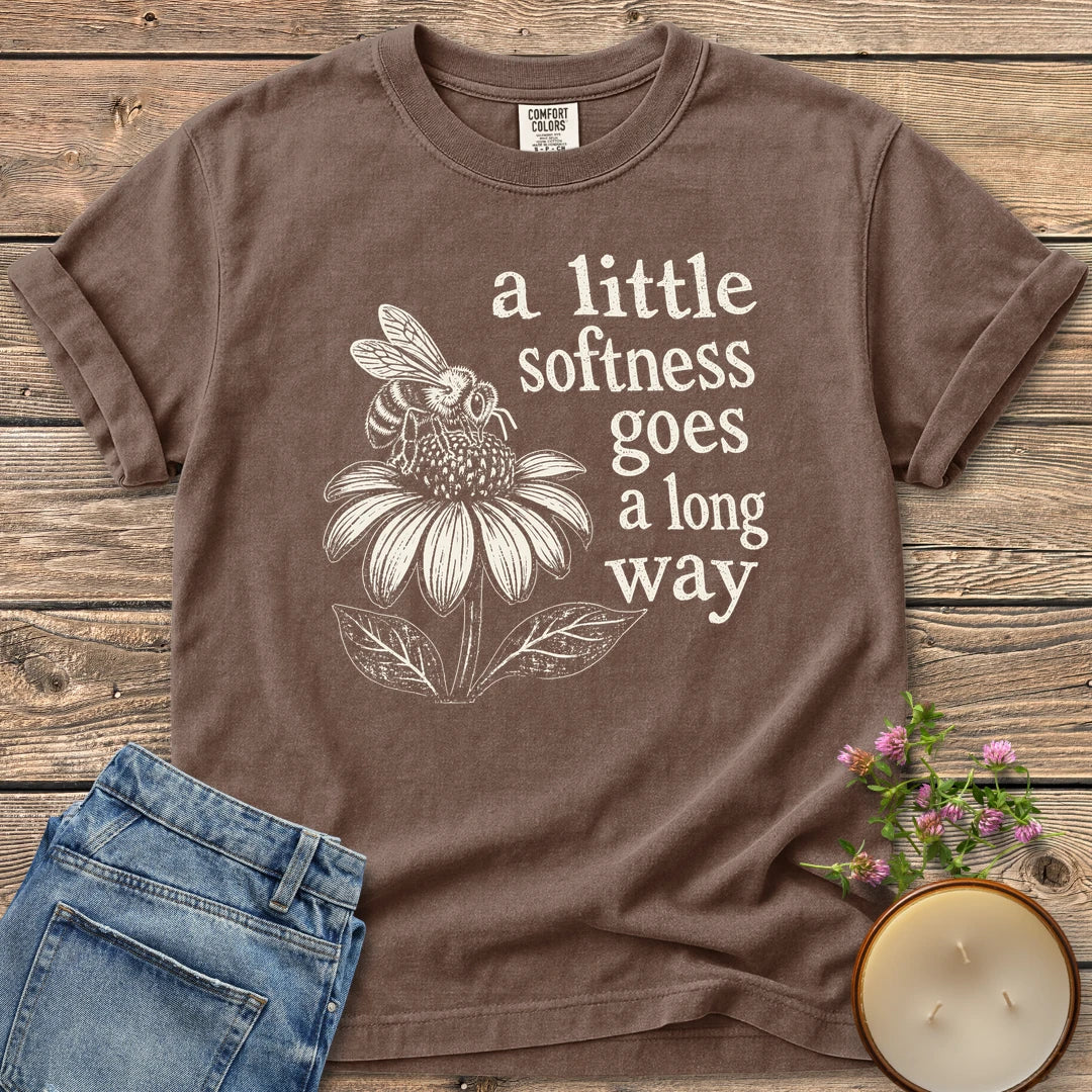 Softness Goes a Long Way t-shirt, a bee on a coneflower with a little softness goes a long way, on an Espresso Comfort Colors tee