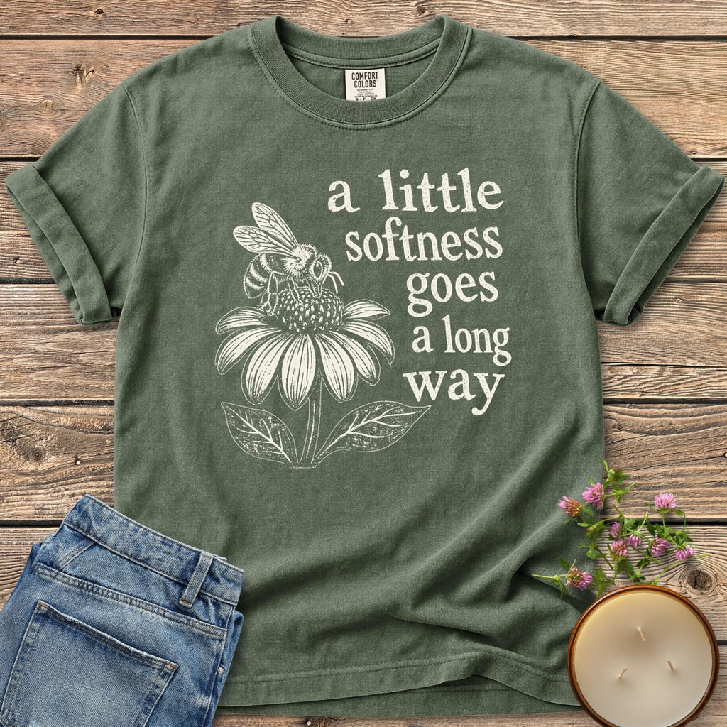 Softness Goes a Long Way t-shirt, a bee on a coneflower with a little softness goes a long way, on a Moss Comfort Colors tee