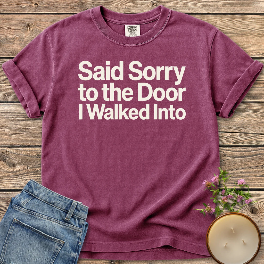 Sorry to the Door t-shirt, Said Sorry to the Door I Walked Into in bold sans type, on a Berry Comfort Colors tee