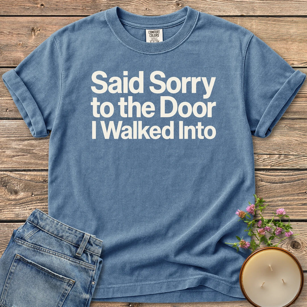 Sorry to the Door t-shirt, Said Sorry to the Door I Walked Into in bold sans type, on a Blue Jean Comfort Colors tee