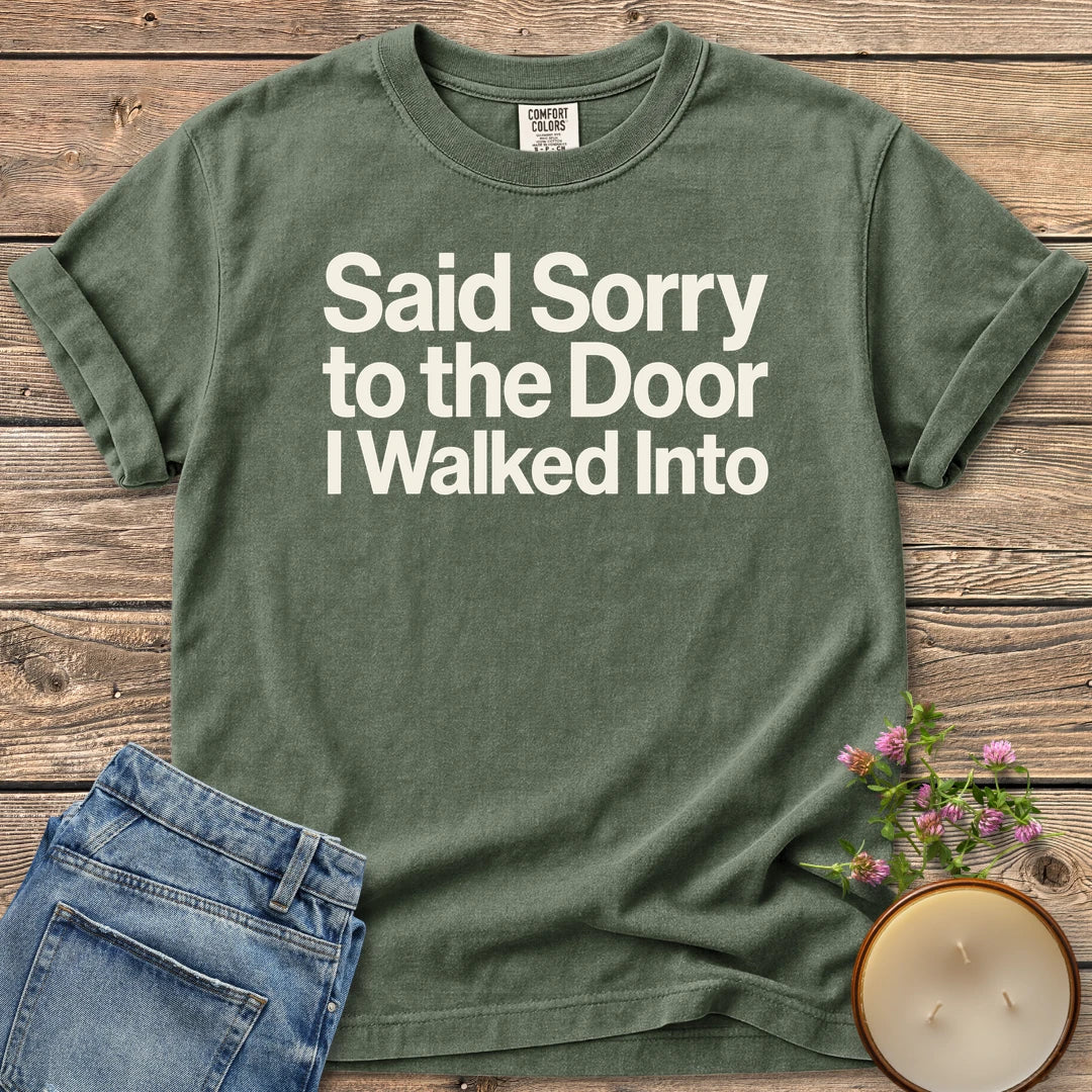 Sorry to the Door t-shirt, Said Sorry to the Door I Walked Into in bold sans type, on a Moss Comfort Colors tee