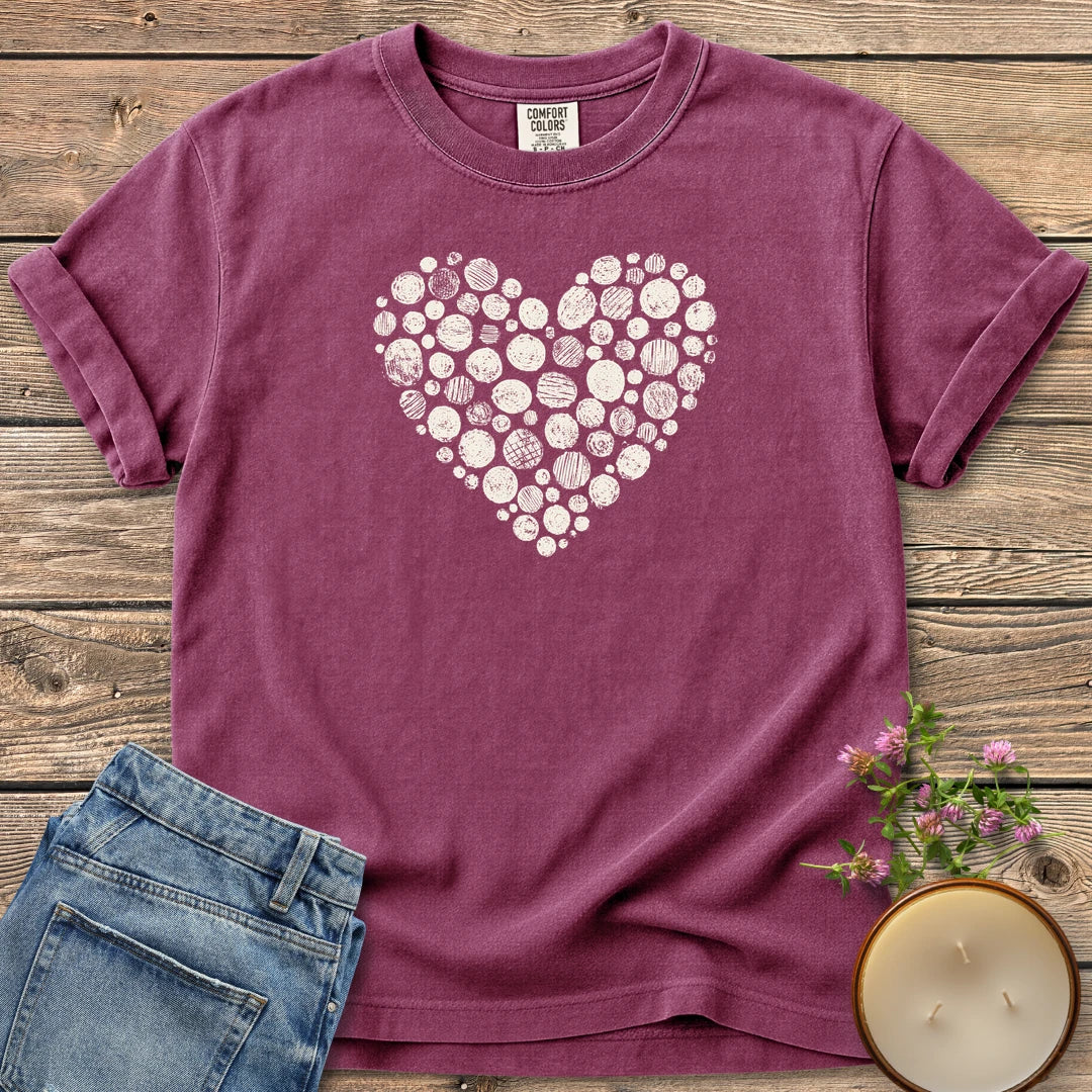 Stipple Heart t-shirt, a heart made of hand-stamped textured circles, on a Berry Comfort Colors tee