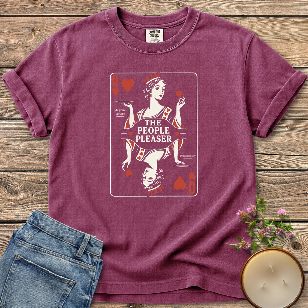 The People Pleaser t-shirt, a Queen of Hearts playing card labeled The People Pleaser, At your service, Unfortunately, on a Berry Comfort Colors tee