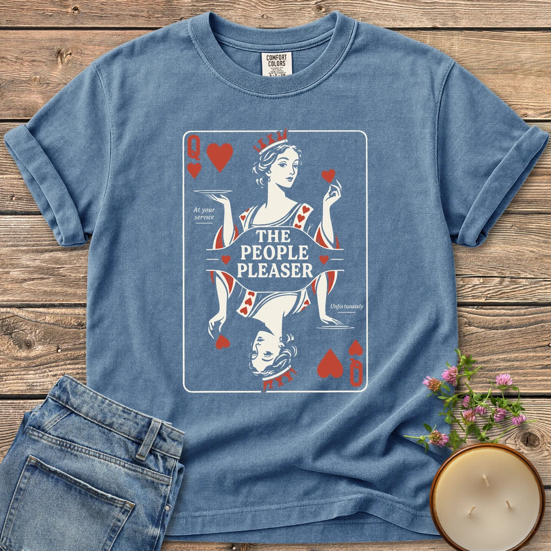 The People Pleaser t-shirt, a Queen of Hearts playing card labeled The People Pleaser, At your service, Unfortunately, on a Blue Jean Comfort Colors tee