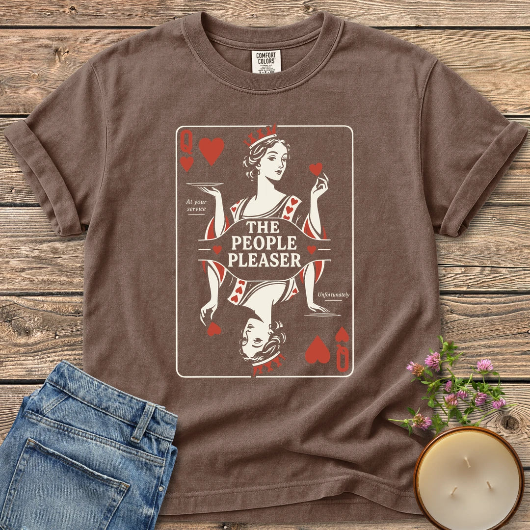 The People Pleaser t-shirt, a Queen of Hearts playing card labeled The People Pleaser, At your service, Unfortunately, on an Espresso Comfort Colors tee