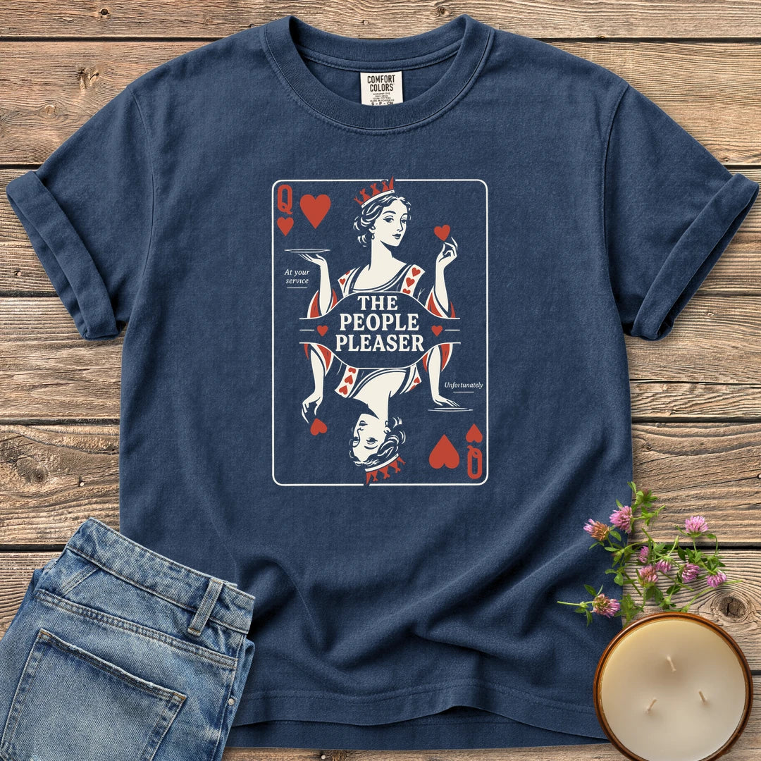 The People Pleaser t-shirt, a Queen of Hearts playing card labeled The People Pleaser, At your service, Unfortunately, on a Navy Comfort Colors tee