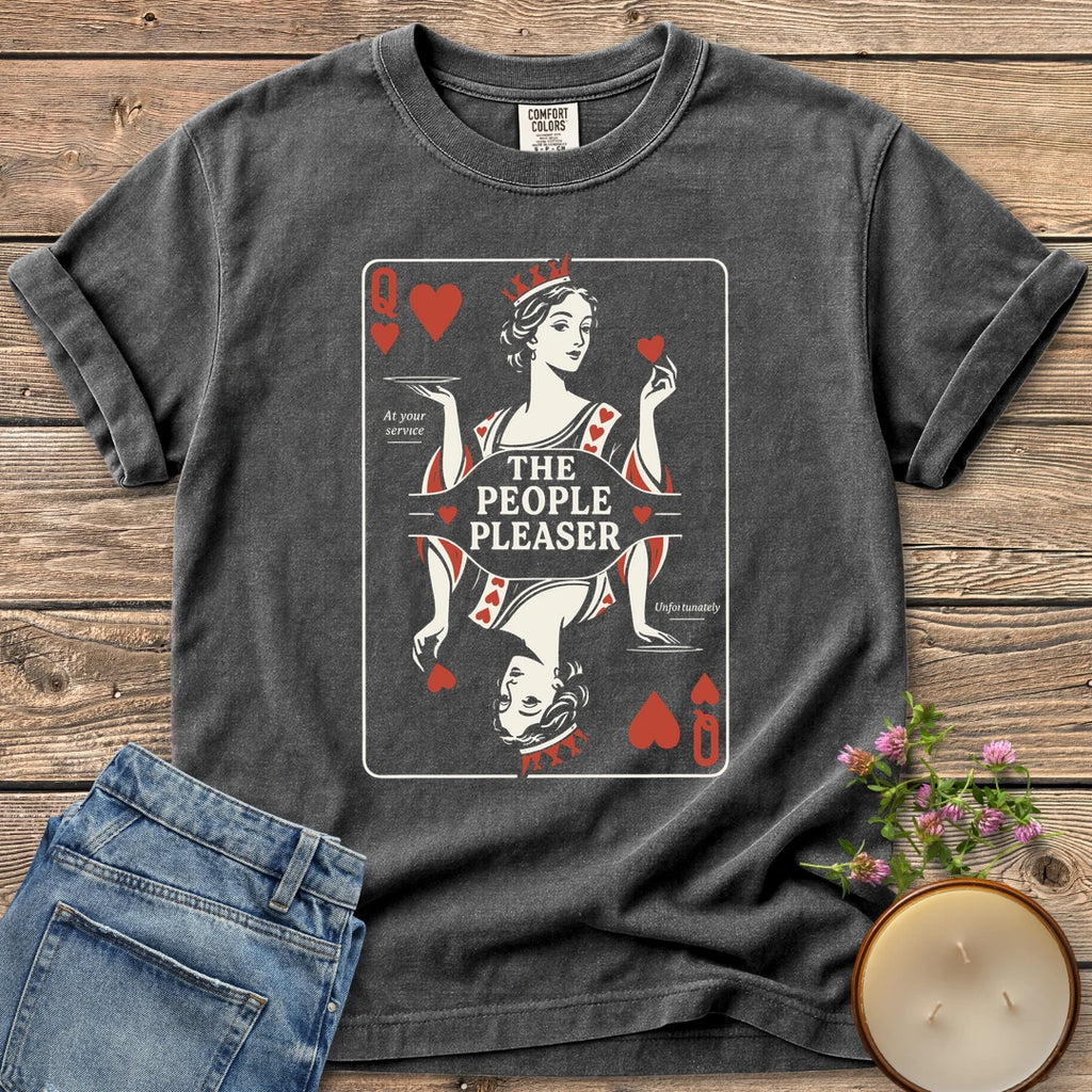 The People Pleaser t-shirt, a Queen of Hearts playing card labeled The People Pleaser, At your service, Unfortunately, on a Pepper Comfort Colors tee