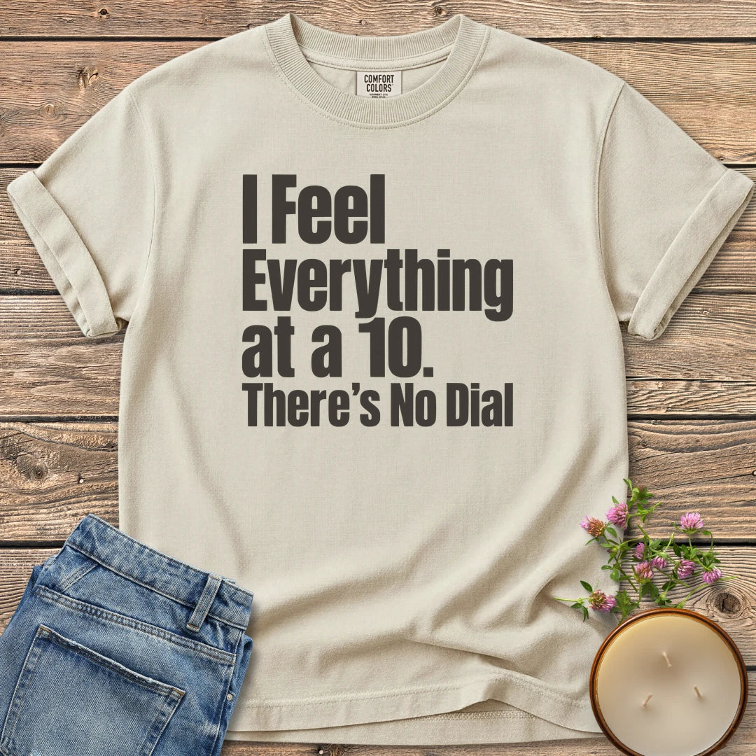 There's No Dial t-shirt, I Feel Everything at a 10. There's No Dial in bold condensed type, on an Ivory Comfort Colors tee