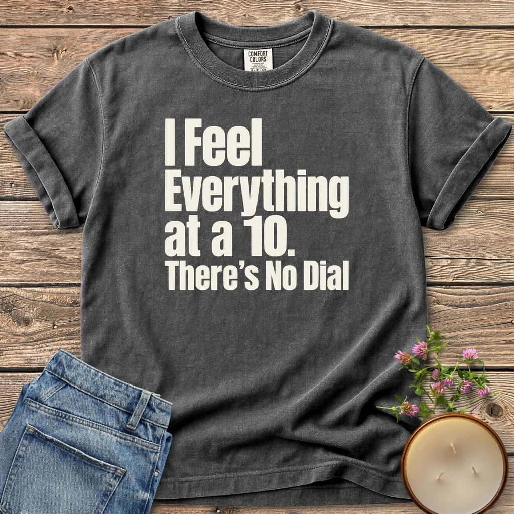 There's No Dial t-shirt, I Feel Everything at a 10. There's No Dial in bold condensed type, on a Pepper Comfort Colors tee