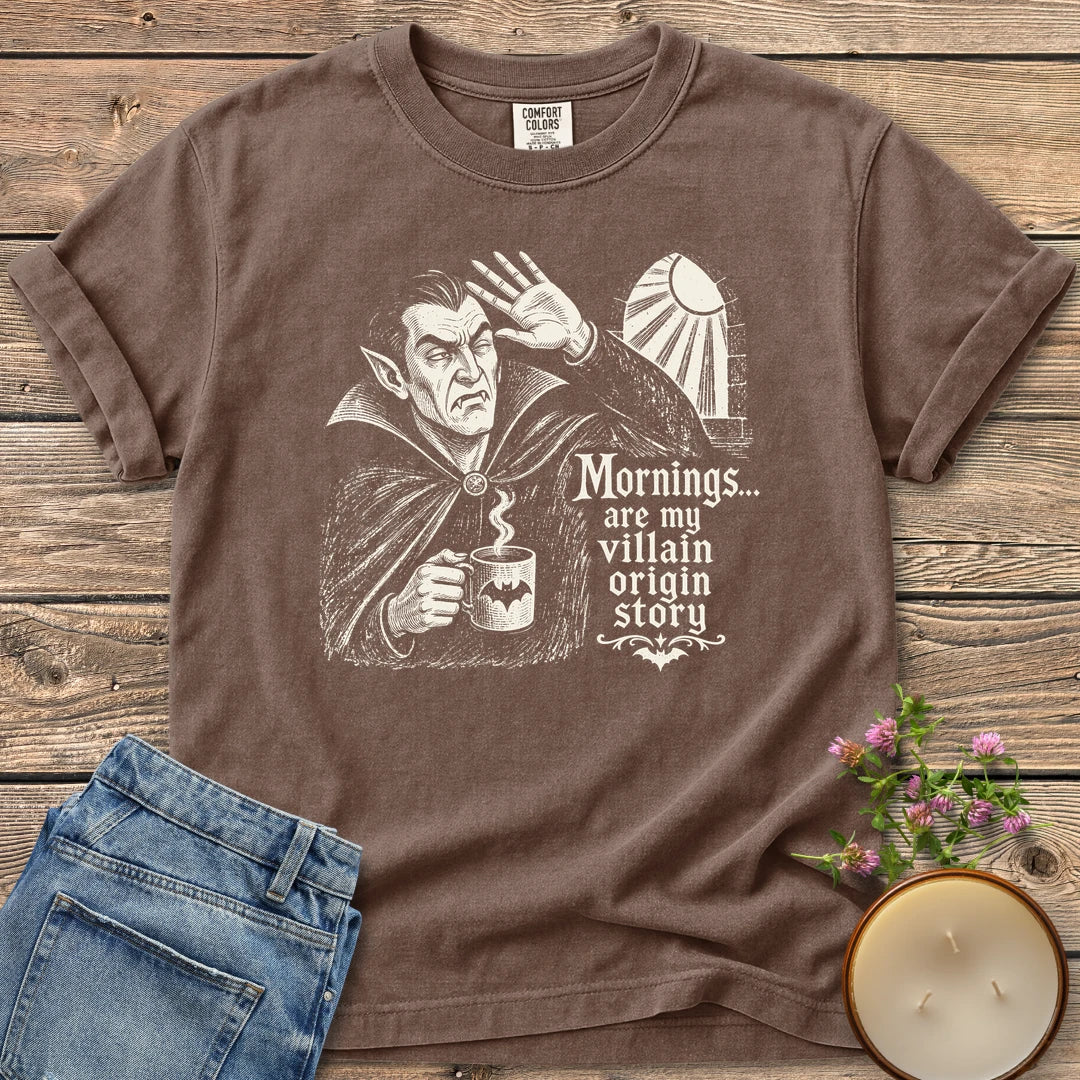 Villain Origin Story t-shirt, a vampire shielding his eyes from sunlight holding a coffee mug with Mornings... are my villain origin story, on an Espresso Comfort Colors tee