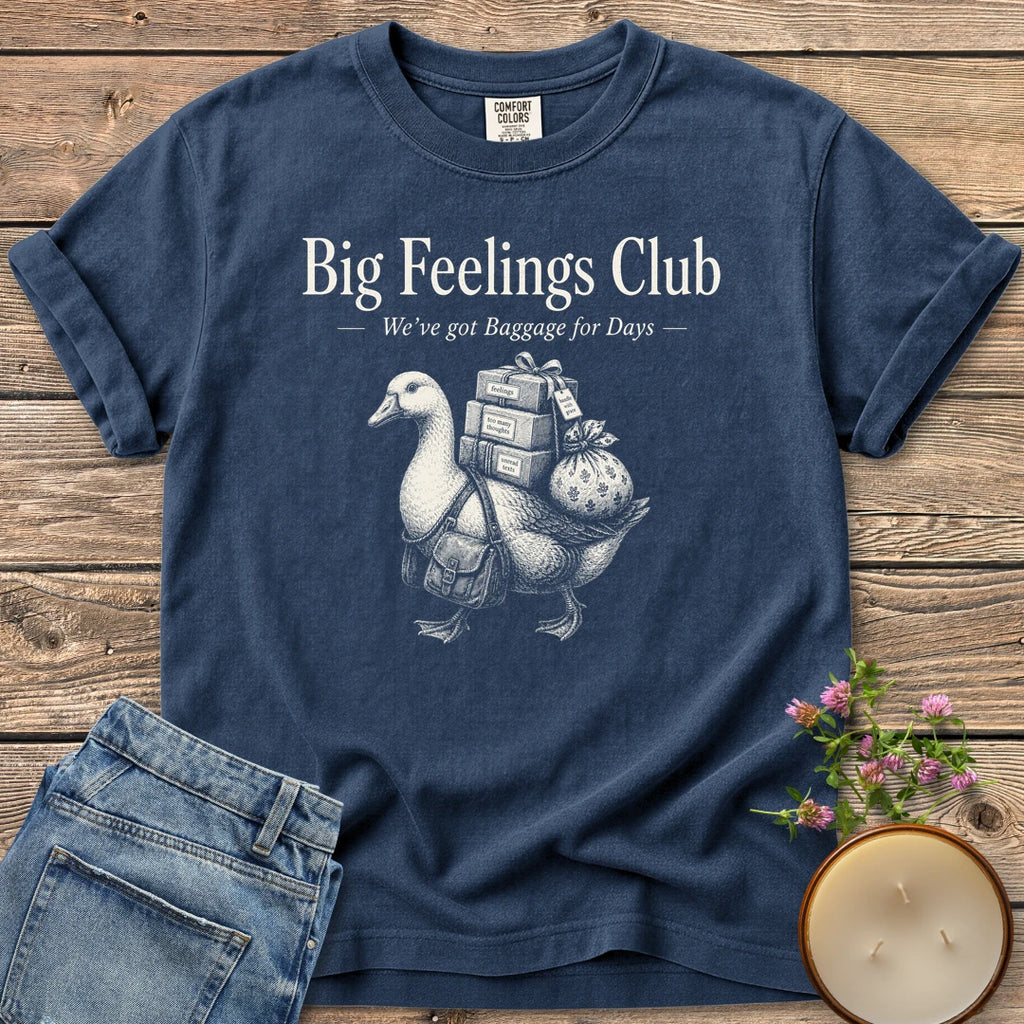 We've Got Baggage for Days t-shirt, a goose carrying boxes of feelings, too many thoughts and unread texts under Big Feelings Club, We've got Baggage for Days, on a Navy Comfort Colors tee