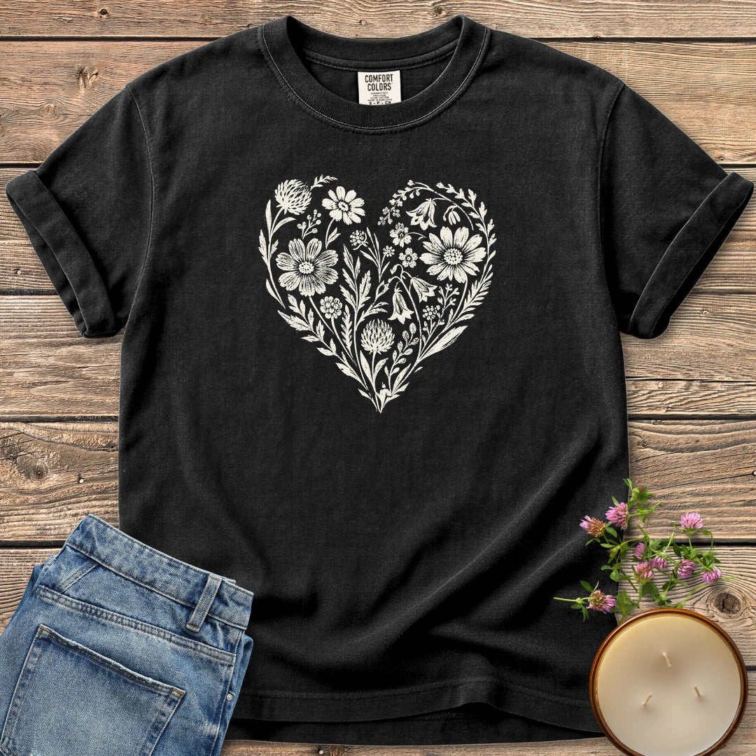Wildflower Heart t-shirt, a heart made of hand-drawn wildflowers and leaves, on a Black Comfort Colors tee